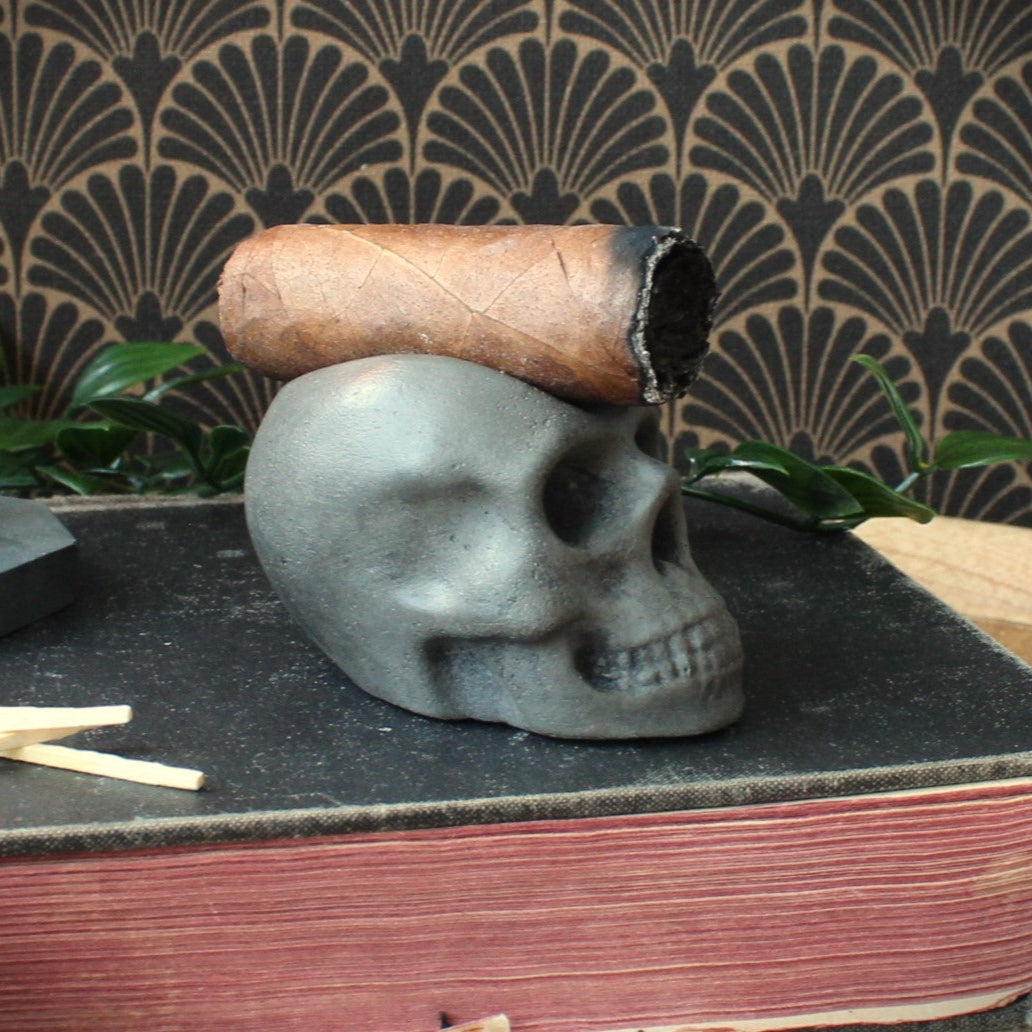 Cast stone skull cigar holder