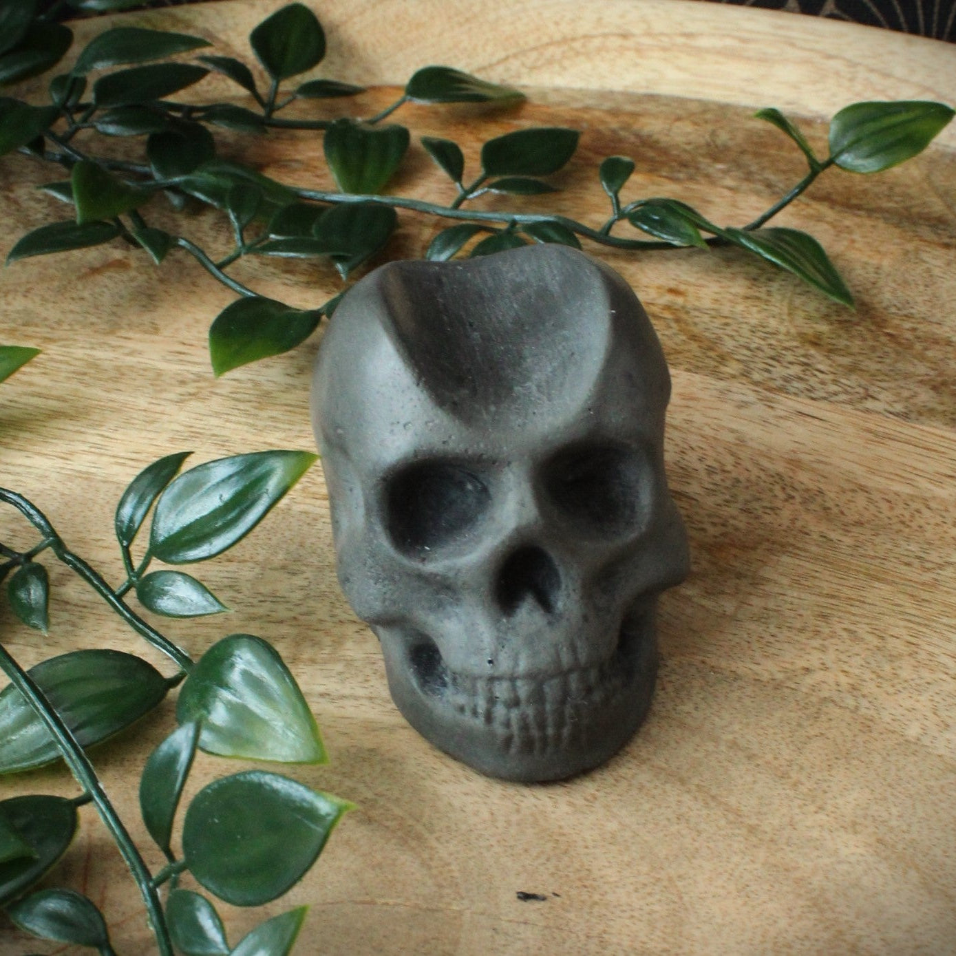 handmade cast stone skull cigar rest , no cigar