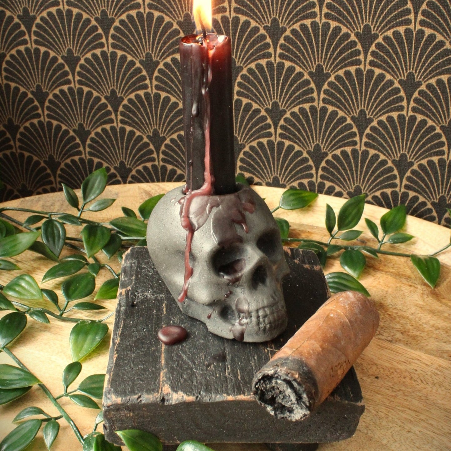 Skull candle holder, dripping wax with cigar