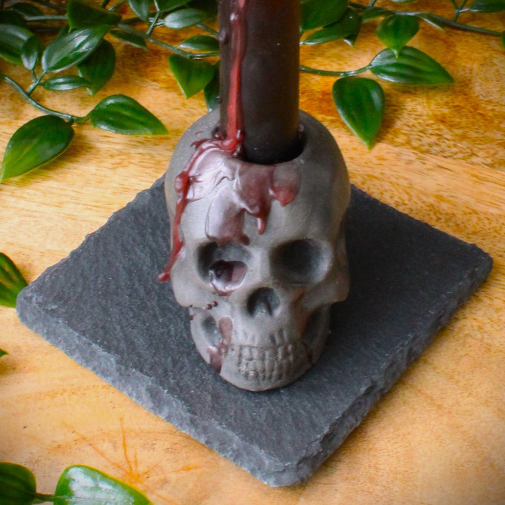 Closeup shot of rustic skull candle holder cast in stone
