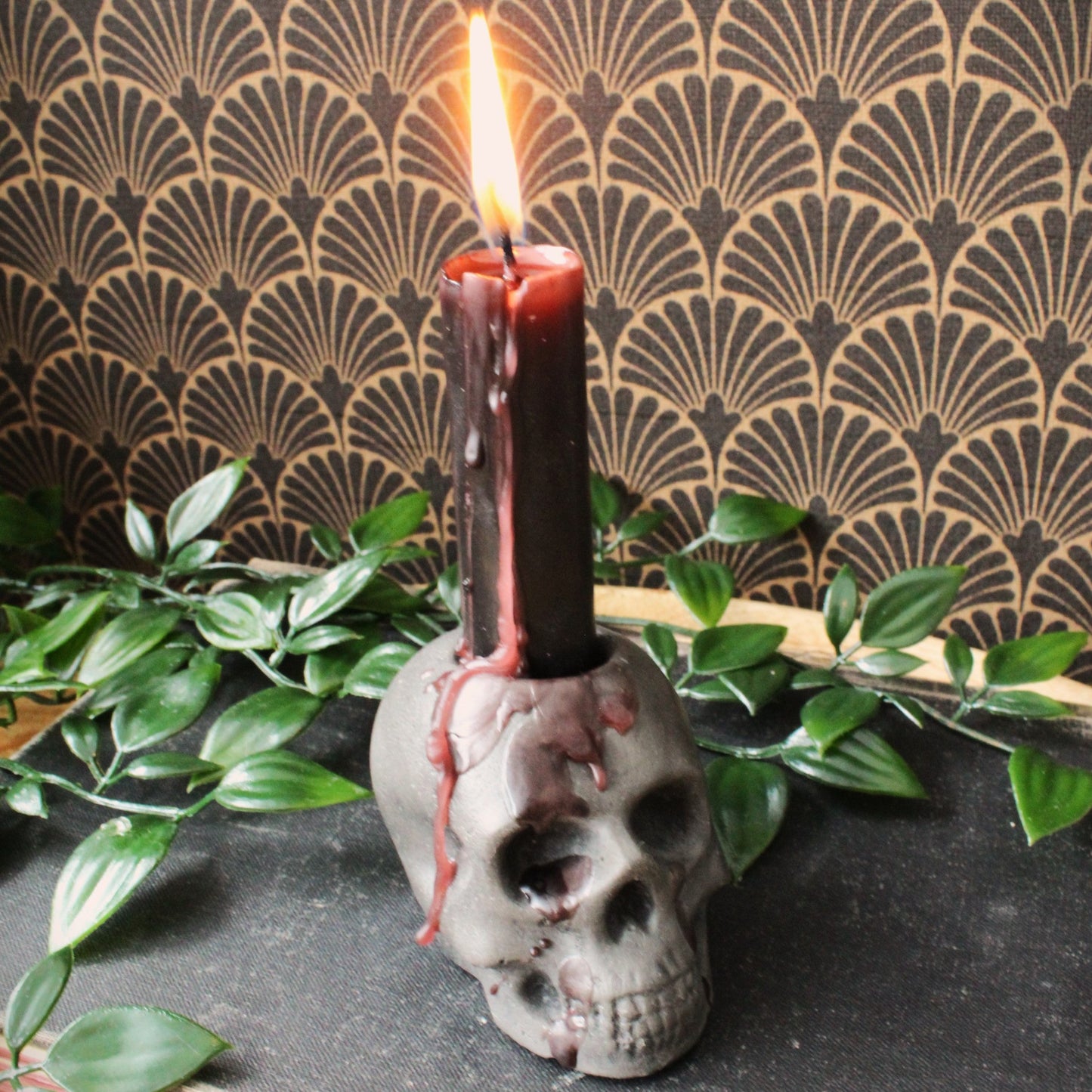 closeup shot of rustic skull candle holder cast in stone