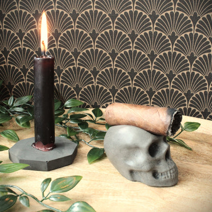 closeup of rustic luxury skull cigar holder cast in stone