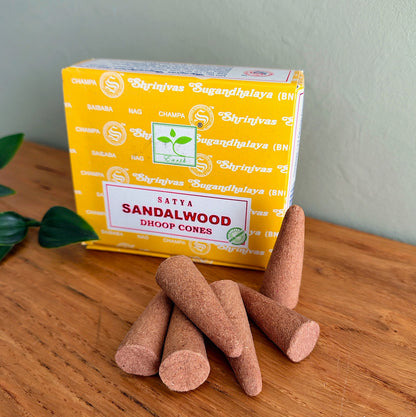 Close-up of Satya Sandalwood Dhoop Cones stacked together with box in background